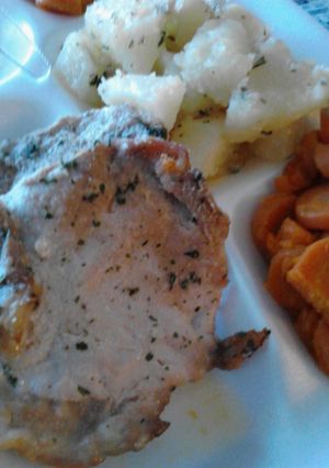 A picture of Extreme Butter Garlic Baked Pork Chops with Potatoes.