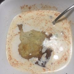 A picture of Crab bisque with souffléd crackers.