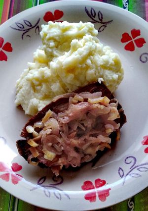 Una foto de Asado de carne encebollado