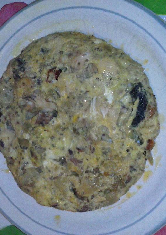Una foto de Tortilla picante con pulpo y verduras