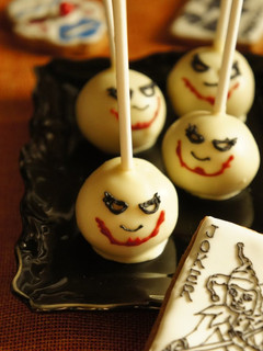 A picture of Halloween Themed "The Joker" Cake Pops.