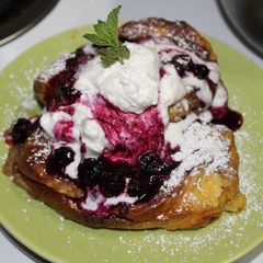 A picture of Stuffed Brioche French Toast with Blueberry Compote & Whipped Cream.