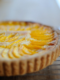 A picture of Yellow Peach Almond Cream Tart.