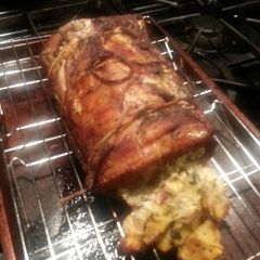 A picture of Creamy Spinach Artichoke Pork Roulade.