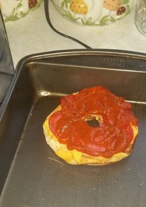 A picture of Beer cheese pizza bagels.