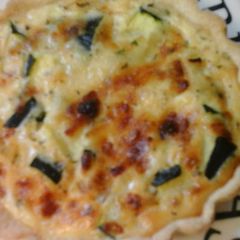 A picture of Low calorie courgette mini quiche with cheese straws.