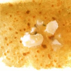 A picture of Flatbread stuffed with potato and onion.