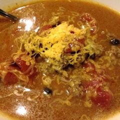 A picture of Cheesy beef and bean soup.