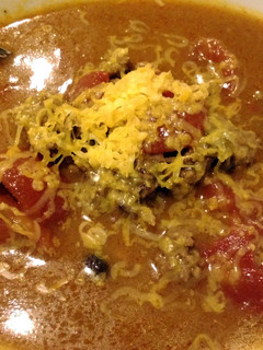 A picture of Cheesy beef and bean soup.