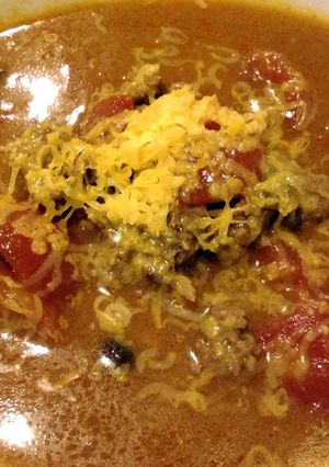 A picture of Cheesy beef and bean soup.