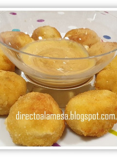 Una foto de Bolitas de arroz y queso