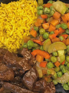 A picture of Curry rice with veggies and.