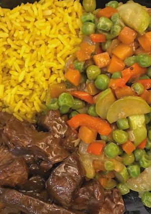 A picture of Curry rice with veggies and.