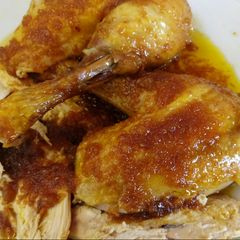 A picture of Roasted Capon with an orange and brandy sauce 🎄.