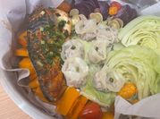 A picture of fish with vegetables