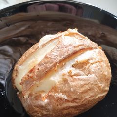A picture of Jacket potato with a cheesy surprise. 🧀 Air Fryer.