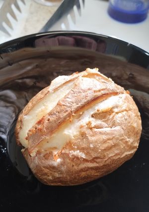 A picture of Jacket potato with a cheesy surprise. 🧀 Air Fryer.