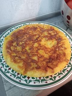 Una foto de Tortilla de patatas Con Cebolla 🧅