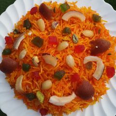 A picture of Orange peel /rind in Zarda (sweet rice dessert).