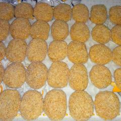 A picture of White paper chicken nuggets (frozen).