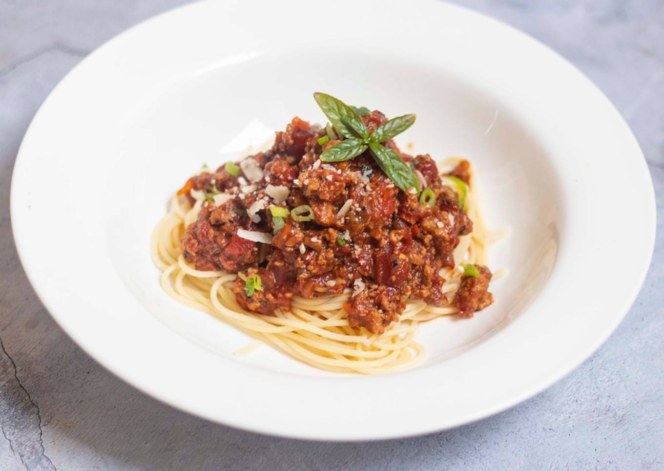 Spaghetti bolognese with Thai green pesto