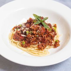 A picture of Spaghetti bolognese with Thai green pesto.