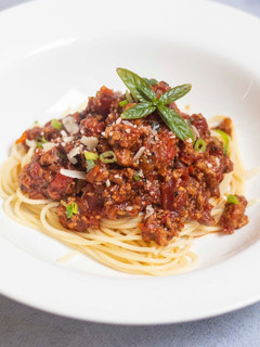 A picture of Spaghetti bolognese with Thai green pesto.