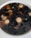 Grass jelly with lychees, tapioca pearls, glutinous rice balls and sago dessert