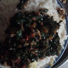 A picture of Vegetable sauce with rice.
