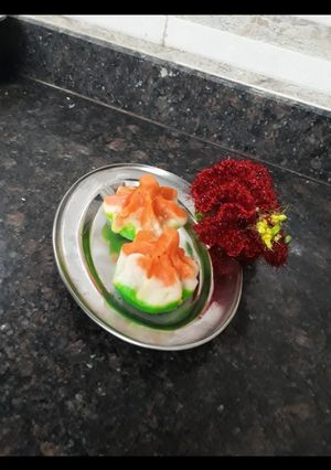 A picture of Tri colour traditional steam Modak Ukadiche Modak.
