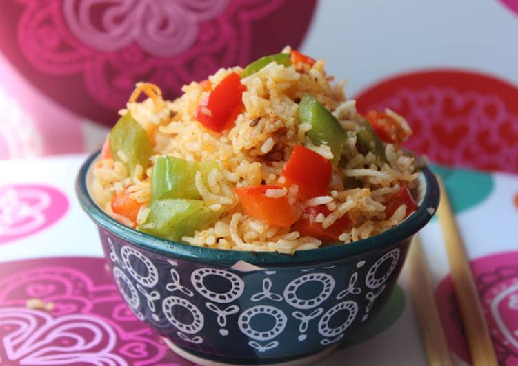 Steps to Make Super Quick Homemade Achari Capsicum Rice
