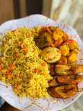 Fried rice with potato casserole and plantain