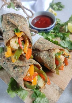A picture of Multigrain methi thepla roll with bell pepper & paneer stuffing.