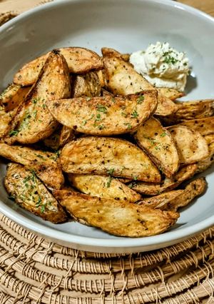 A picture of Potato Wedges (Thick-Cut French Fries) with Onion Sour Cream Dip.