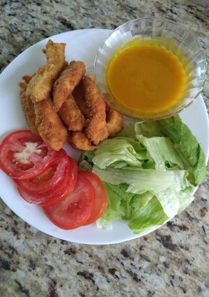 Una foto de Dedos de pollo en salsa de mango y habanero