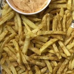 A picture of Masala Fries with mayo dip.