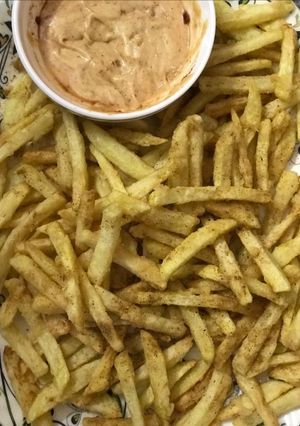 A picture of Masala Fries with mayo dip.