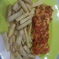 A picture of Fried egg with minced meat and fried yam.