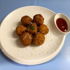 A picture of Rice cheesy pakoda.