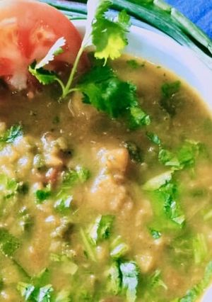 A picture of Spring onions and potato curry.
