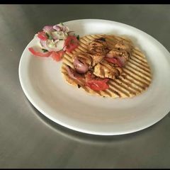 A picture of Poulet enjoyed on roasted papad.