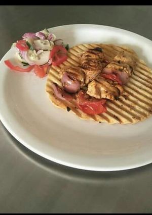 A picture of Poulet enjoyed on roasted papad.