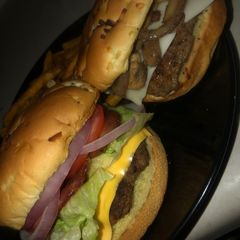 A picture of French onion burgers (mushroom & Swiss or fully loaded bacon burgers).