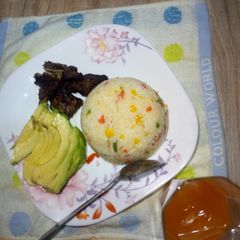 A picture of Fried rice,ovacado and baked beef.