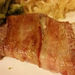 A picture of Brown sugar bacon wrapped pork chops.