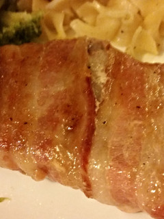 A picture of Brown sugar bacon wrapped pork chops.