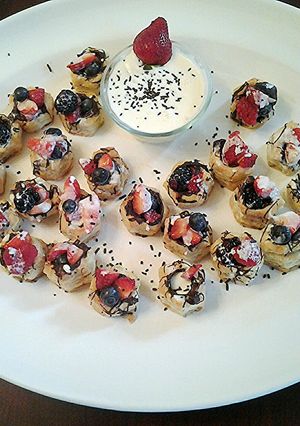 A picture of Creme Anglaise fruit tarts.