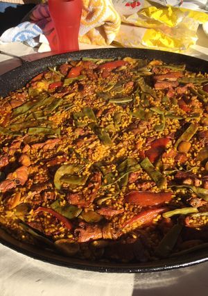 A picture of Paella with Vegetables and Meat.