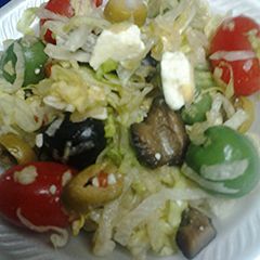 A picture of Lettuce olive and tomato salad.