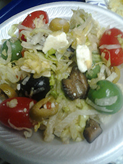 A picture of Lettuce olive and tomato salad.